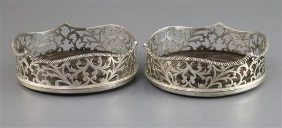 A pair of Victorian foliate-pierced silver bottle coasters with wavy gadrooned rims, London 1841, Charles & George Fox, 14.1cm.